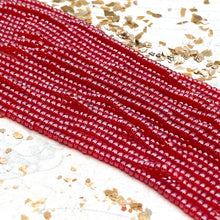 Load image into Gallery viewer, 10/0 Glowing Lady in Red Seed Bead Hank
