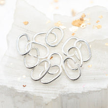 Load image into Gallery viewer, Sterling Silver Plated 9mm Textured Oval Jump Rings - 12pcs
