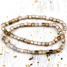 Load image into Gallery viewer, 4mm Cube Bead Strand White with a Gold Finish
